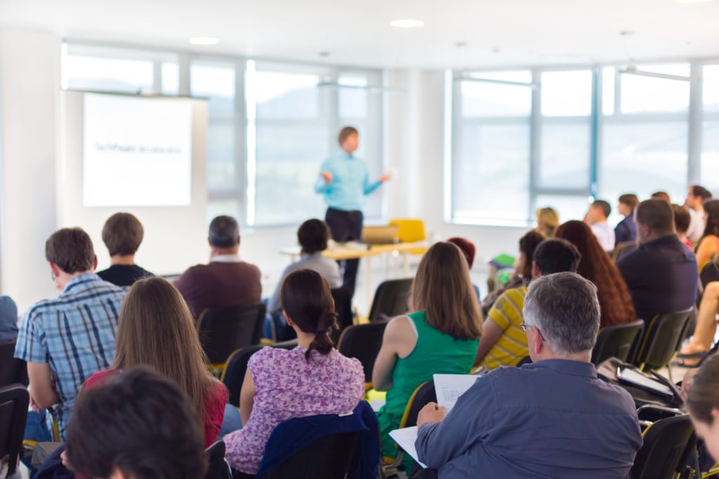Speaker at Business convention and Presentation. iStock 498565457 scaled